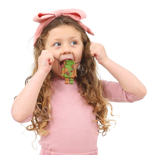 Girl using the Robot Chewy necklace