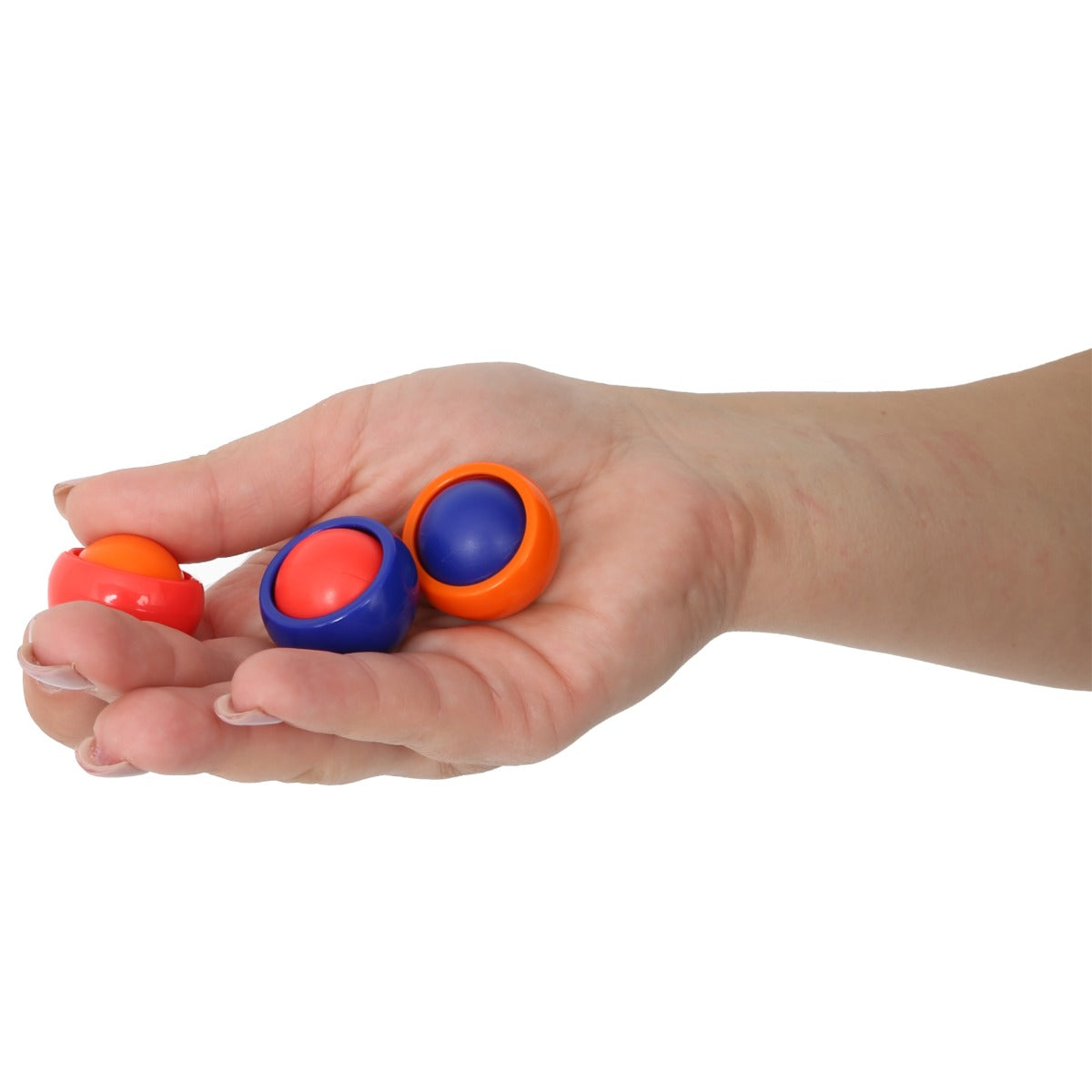 hand holding three Rollease balls in Colors: Orange, red and blue