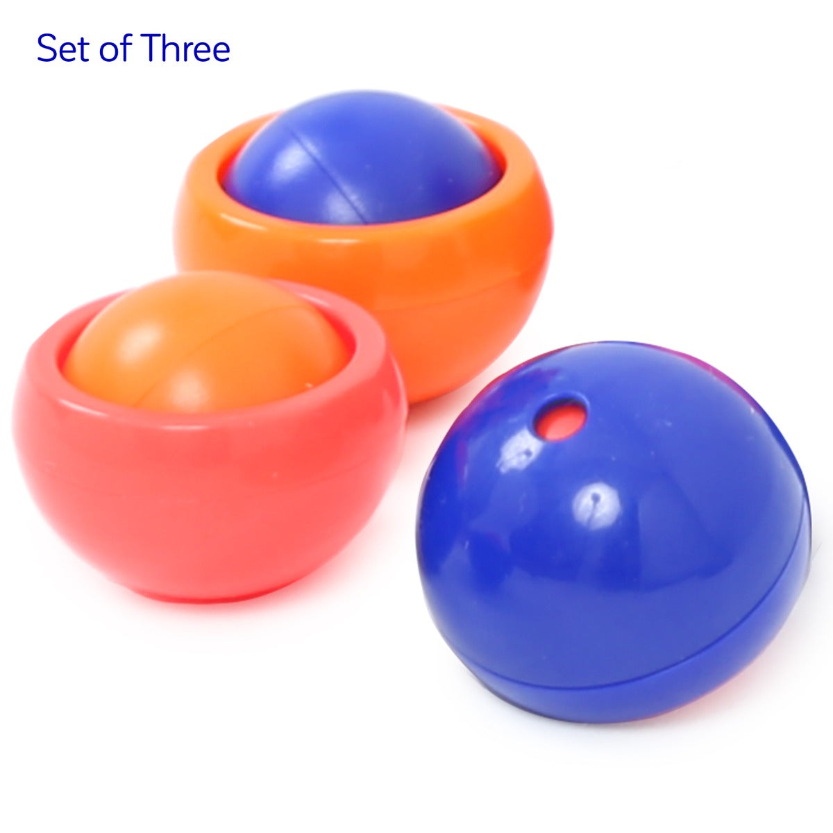 three Rollease balls in Colors: Orange, red and blue