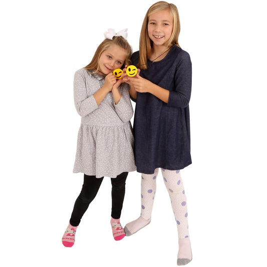 Two girls smiling while showing their Winking Emoji Chewy Necklaces