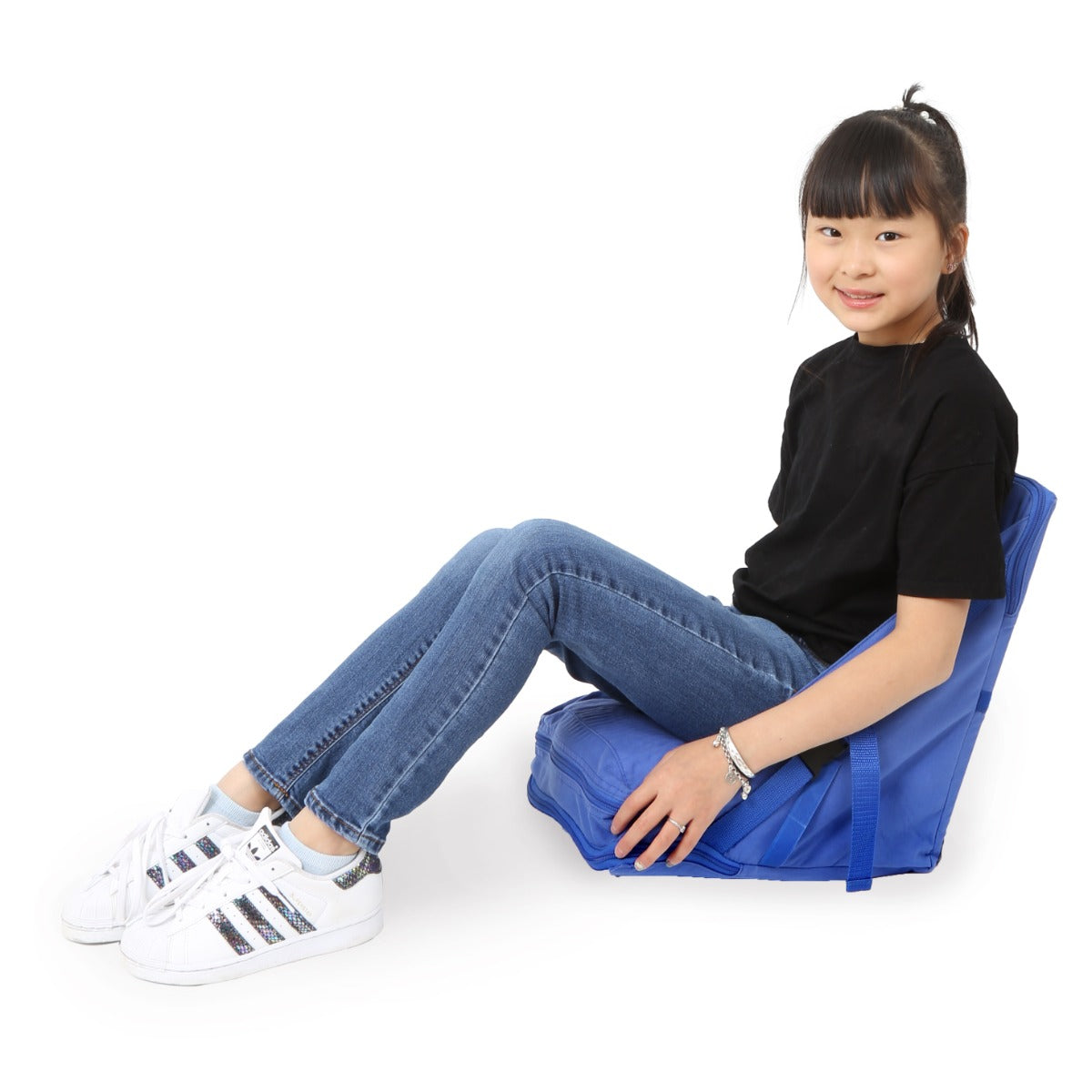 Girl siting on the blue Floor Chair