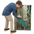 Boy playing with the Sensory Wall Panel