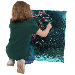 Child playing with the Sensory Wall Panel