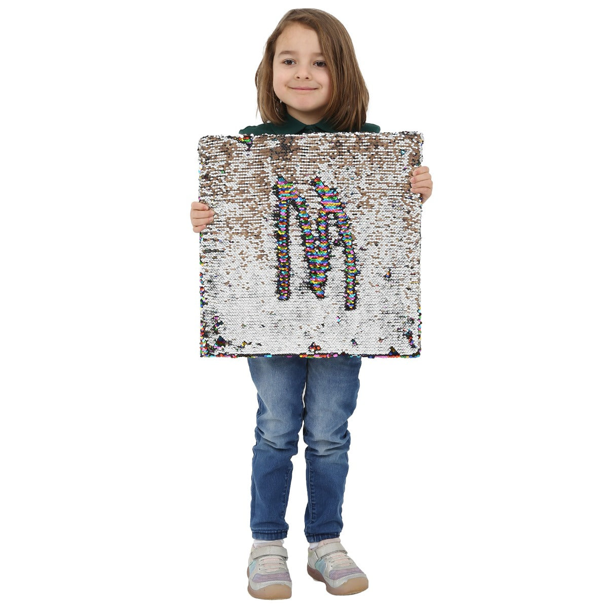 Child smiling while holding the Sensory Wall Panel