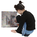 Girl playing with the Sensory Wall Panel