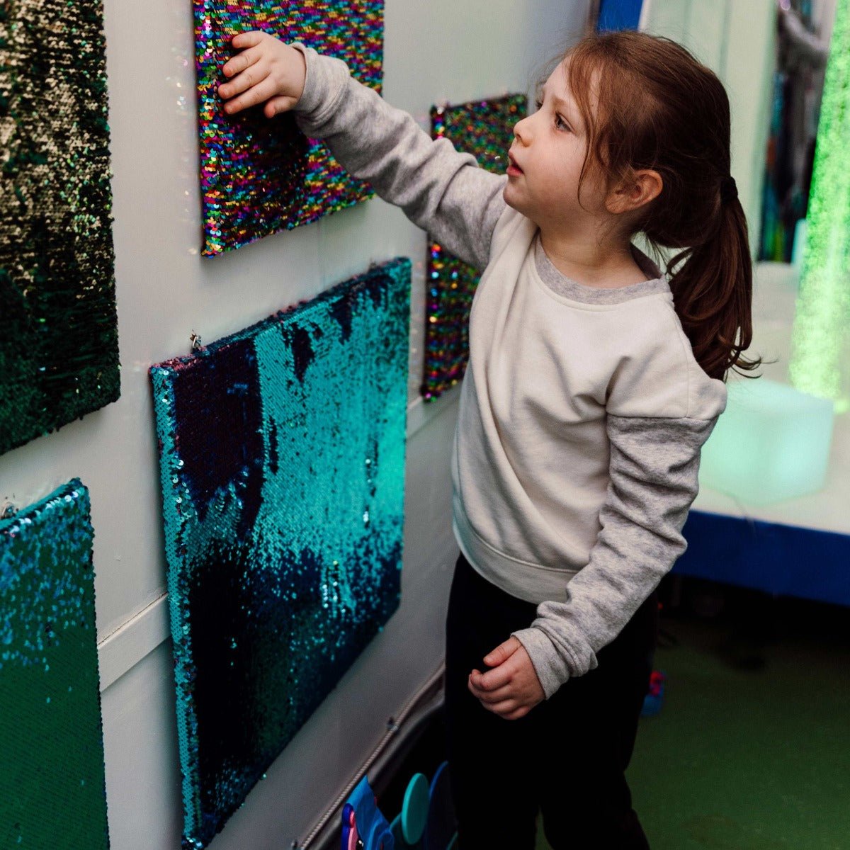 Child playing with a Sensory Wall Panel