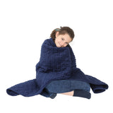 Girl smiling while using the Minky Weighted Blanket