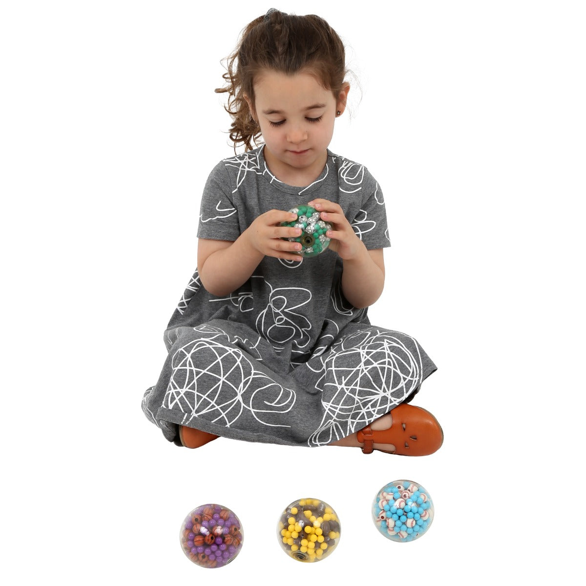 Girl holding the Sports Fun Fidget Balls