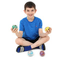 Boy smiling while holding the Sports Fun Fidget Balls