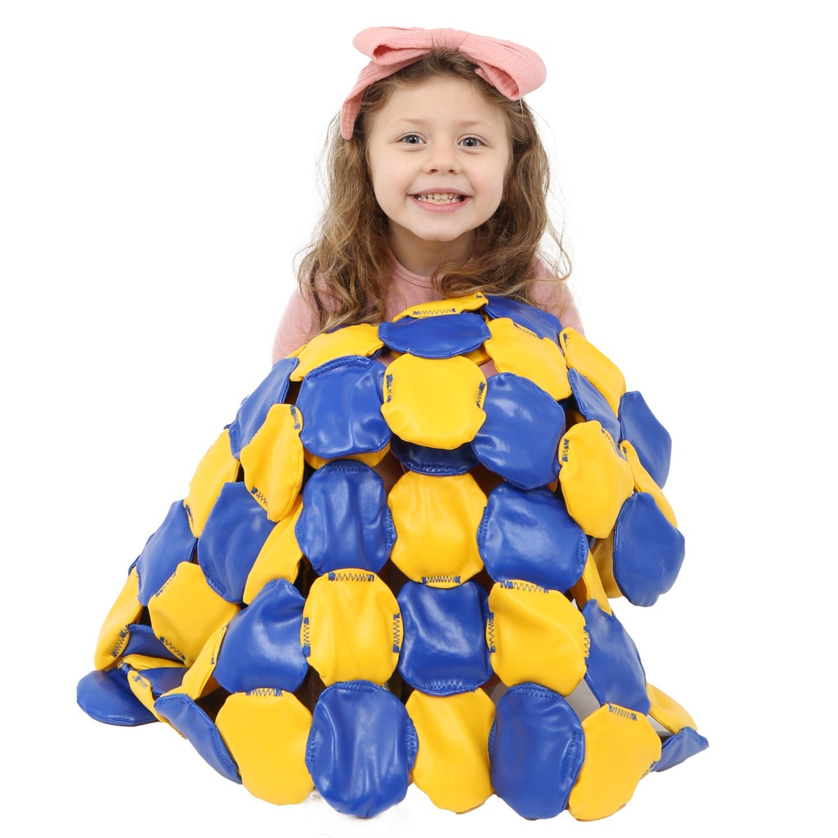 Girl smiling while holding the Weighted Disc Blanket