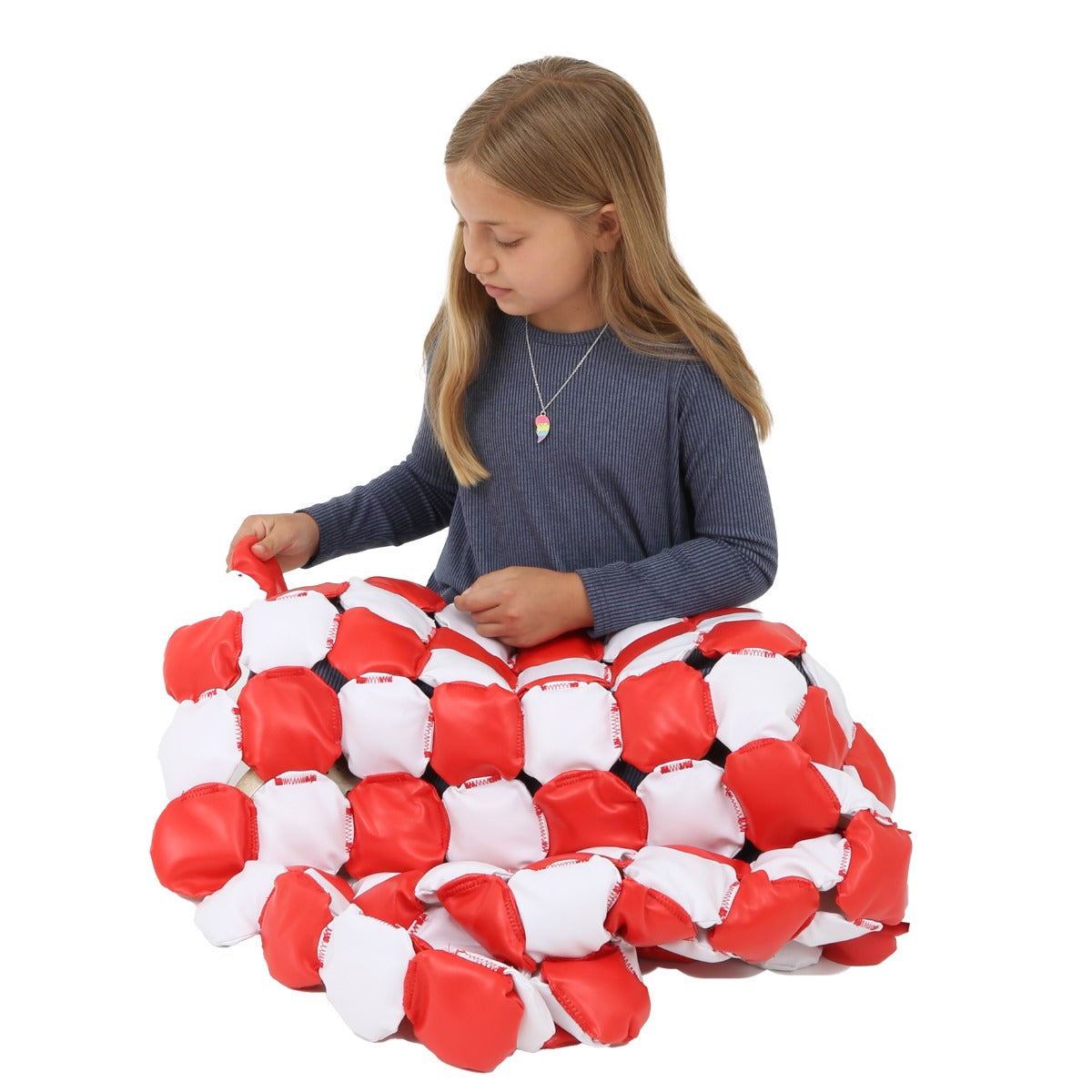 Girl playing with the Weighted Disc Blanket