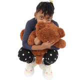 Girl hugging the Brown Weighted Teddy Bear