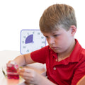 Boy playing while using the Time Timer 8" Learning Center Classroom Set
