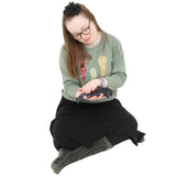 Girl using the Weighted Sequin Fidget