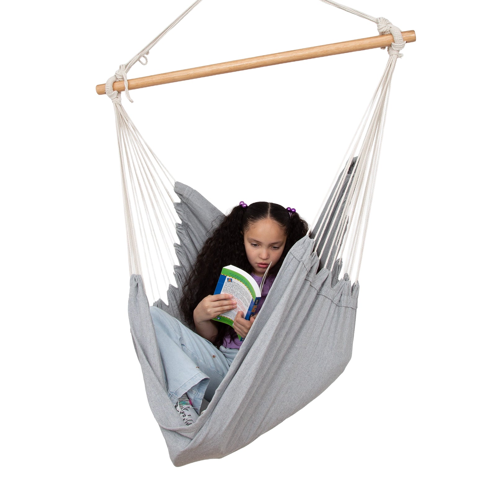 Girl reading while using the Hanging Hammock Chair