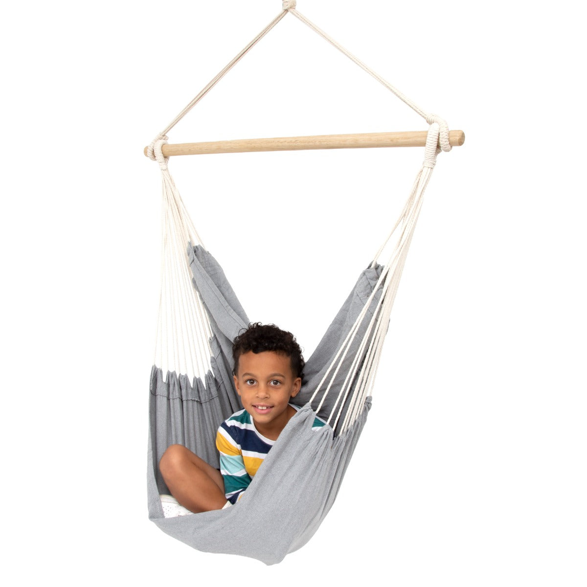 Boy sitting happily in the Hanging Hammock Chair