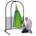 child in therapy hammock swing attached to swing stand