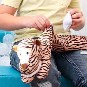 Boy preparing the Toby The Tiger Neck Pillow