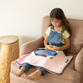 Child using the Sensory Basics Weighted Lap Pad