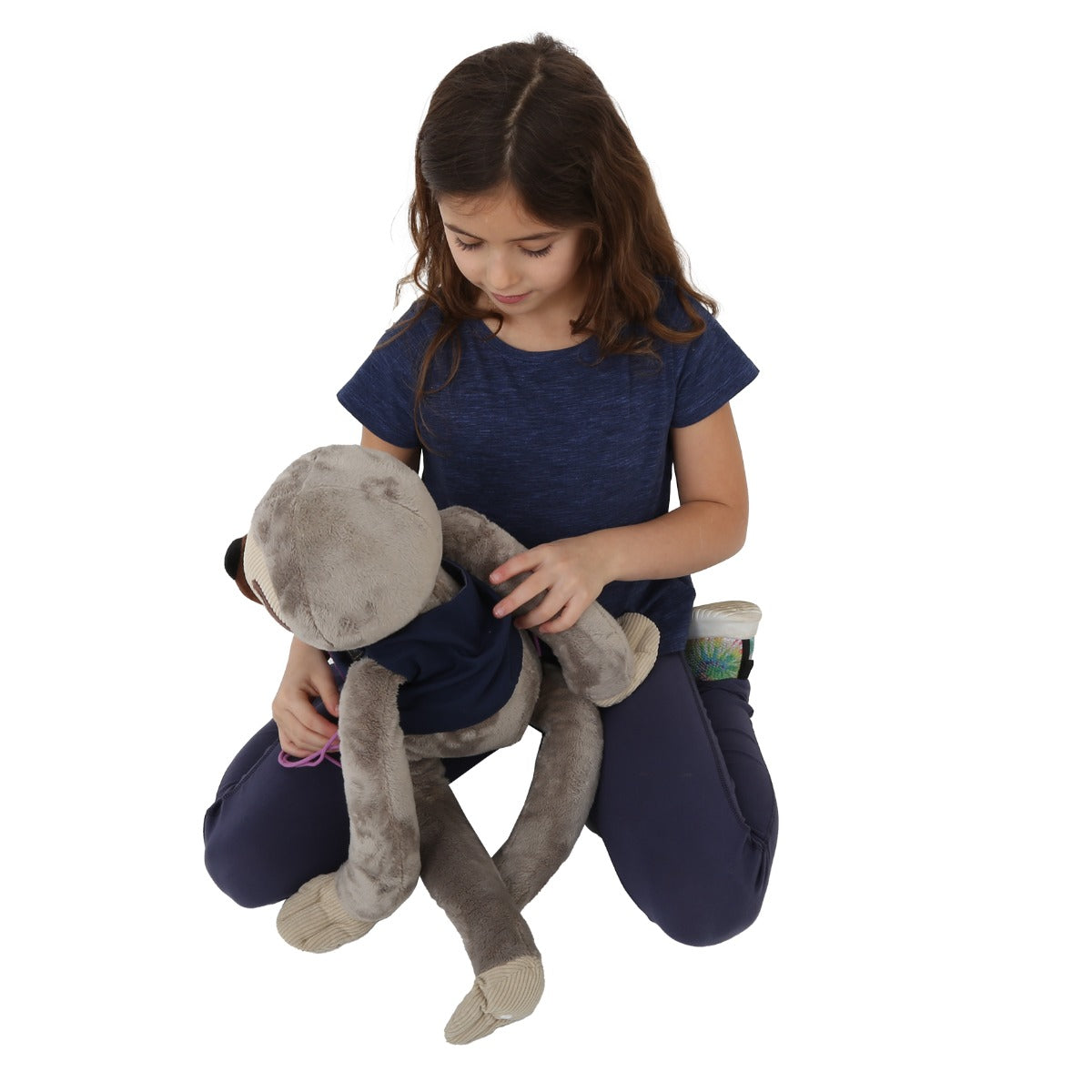 Girl putting the Mini Me Dressing Vest on animal teddy bear