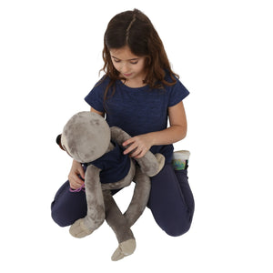 Girl putting the Mini Me Dressing Vest on animal teddy bear
