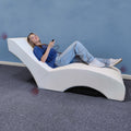 Girl laying on the Vibro-Acoustic Lounger