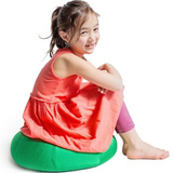 Girl sitting on the green Mushy Smushy Bean Bag Chair