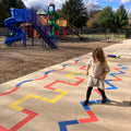 child playing on the Outdoor Paint-A-Path