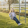 front view of girl swinging outdoors on the Macrame Doorway Swing