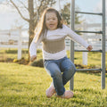 girl swinging faced down on the Macrame Doorway Swing