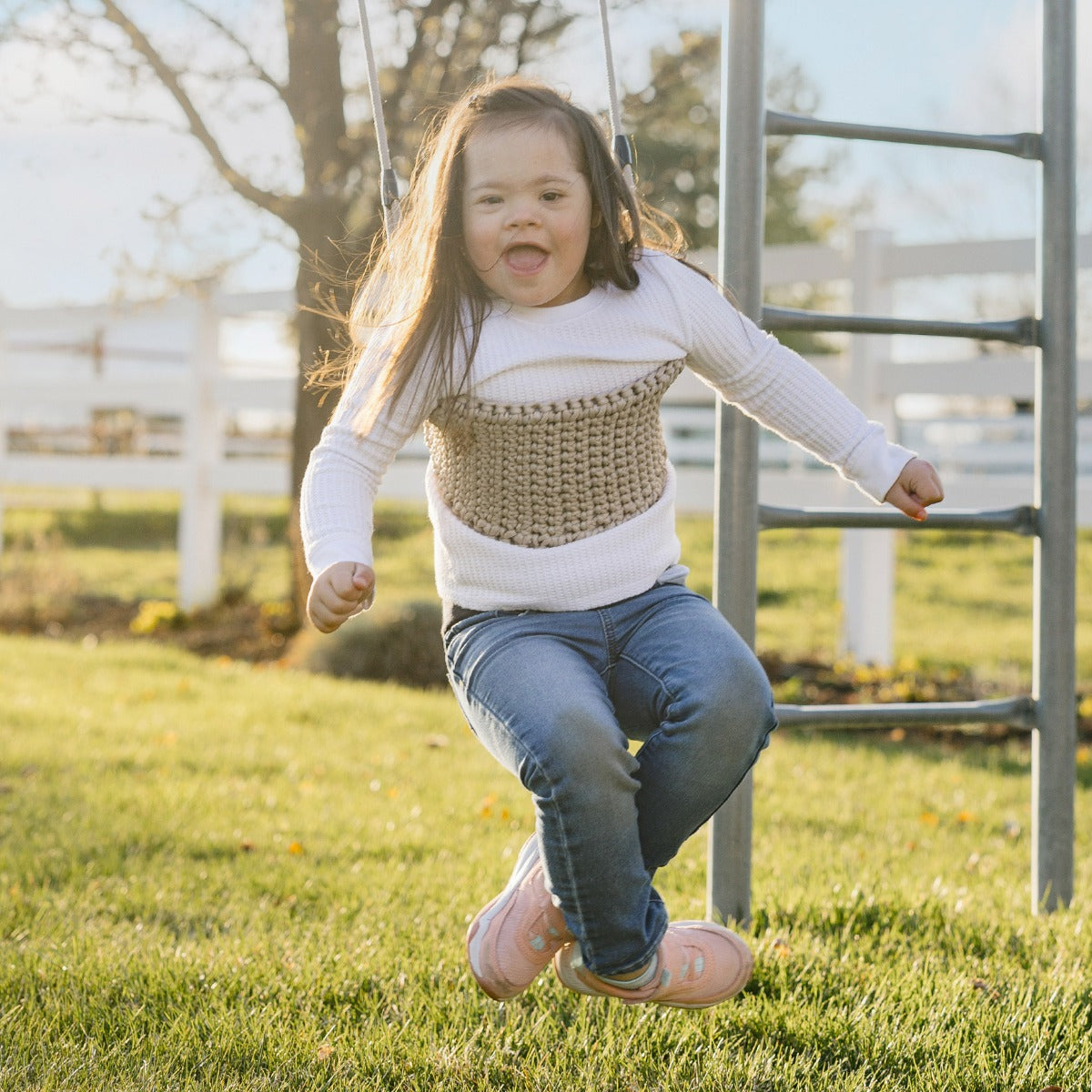 girl swinging faced down on the Macrame Doorway Swing
