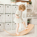 Girl on the Wooden Balance Board