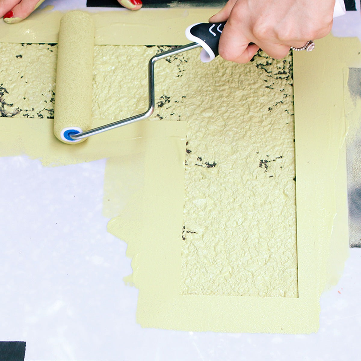 painting a line on a stencil from the Outdoor Paint-A-Path