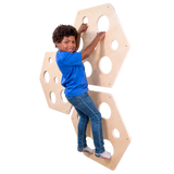 Child climbing on the Honeycomb Climbing Panels - Set of 3