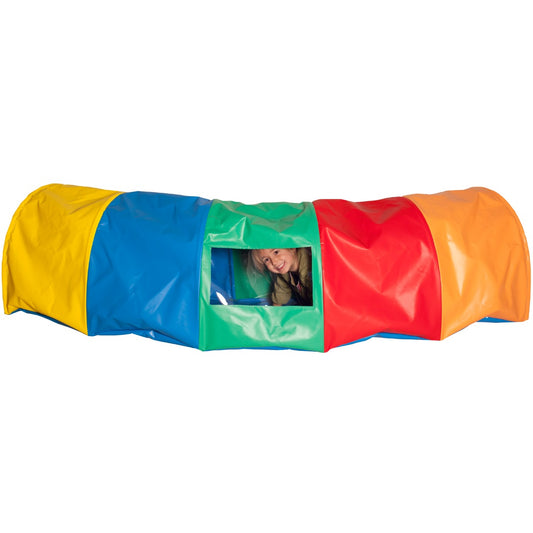 Child smiling while inside the Rainbow Tunnel