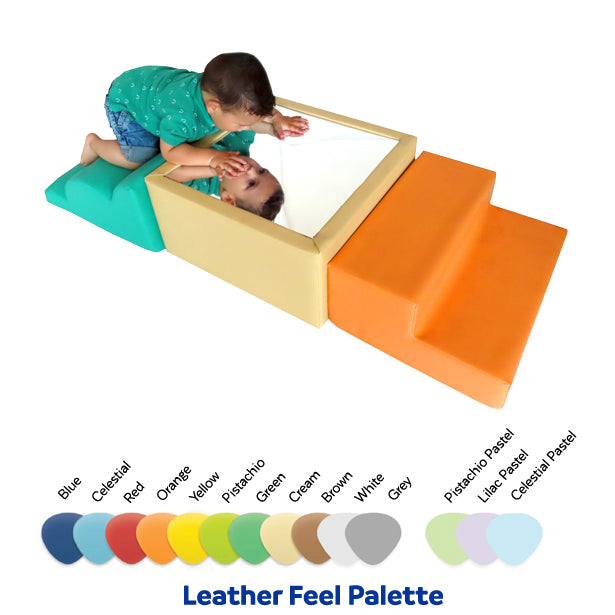 Baby looking into the mirror of the SensaSoft™ Play Set