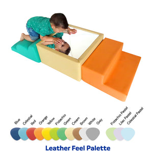 Baby looking into the mirror of the SensaSoft™ Play Set