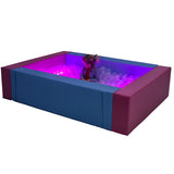 Girl playing in the SensaSoft™ Ball Pit with Lights