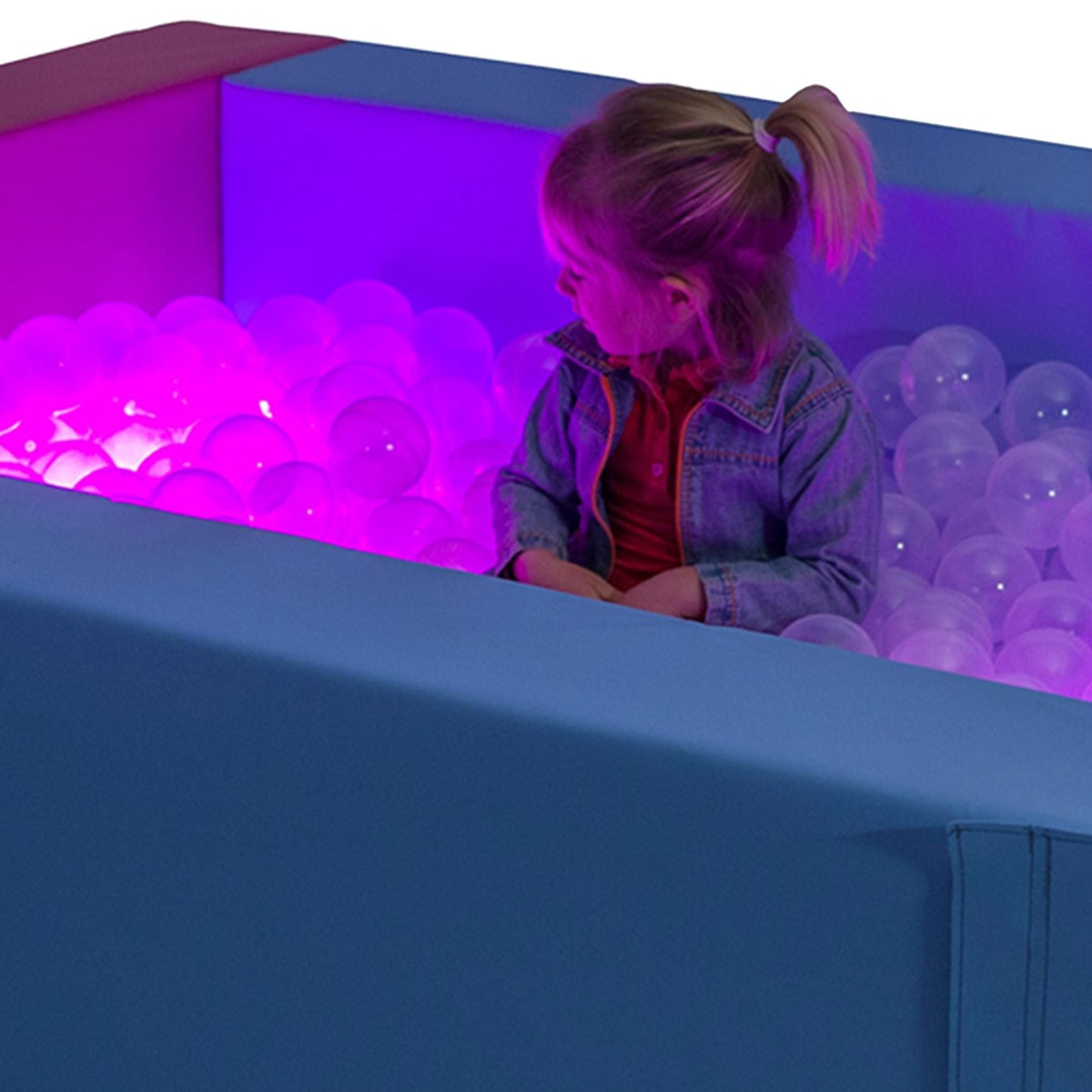 Girl playing in the SensaSoft™ Ball Pit with Lights