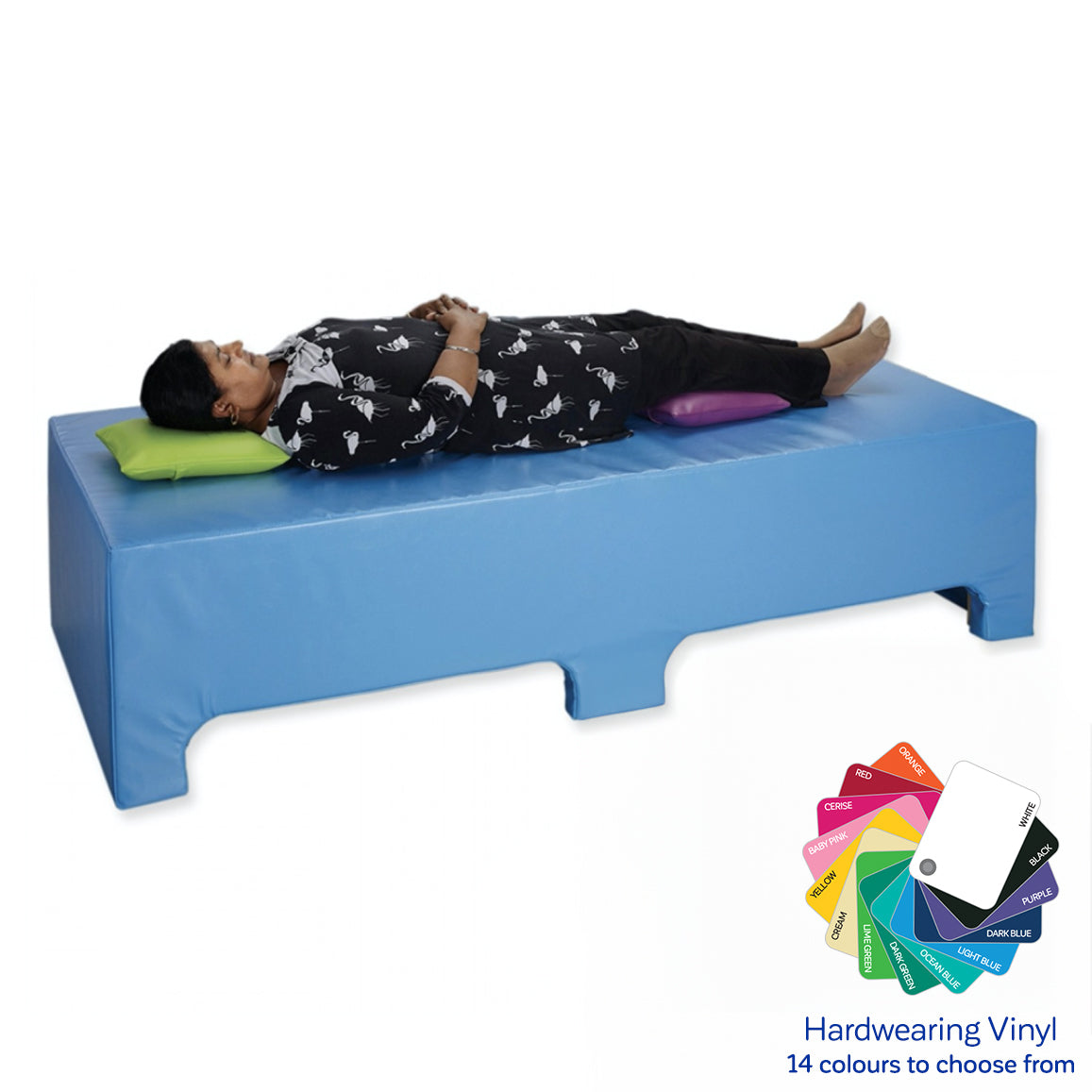 Woman laying on the blue SensaSoft Vibroacoustic Bench
