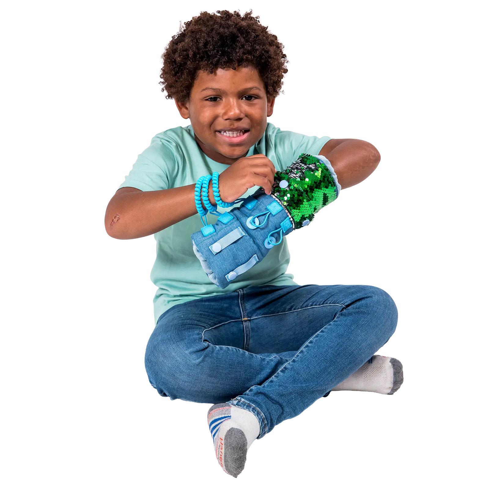 Boy smiling while playing with the Busy Fingers Fidget Muff