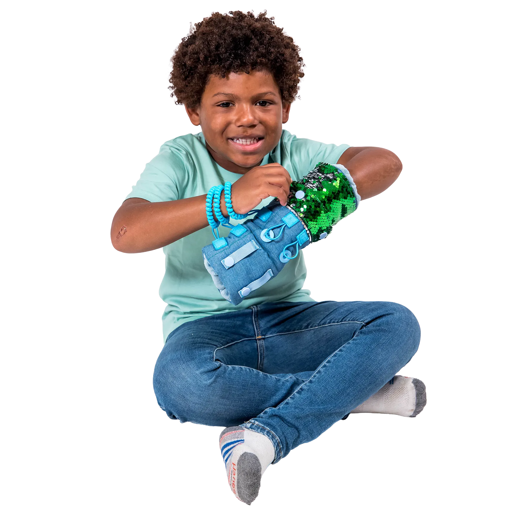 Boy smiling while playing with the Busy Fingers Fidget Muff