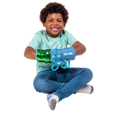 Boy smiling while playing with the Busy Fingers Fidget Muff