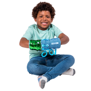 Boy smiling while playing with the Busy Fingers Fidget Muff