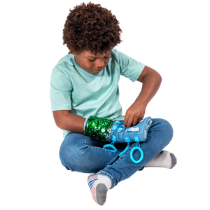 Boy playing with the Busy Fingers Fidget Muff