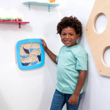 Child standing near the Swirling Storm Panel