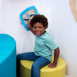 Child sitting near the Swirling Storm Panel