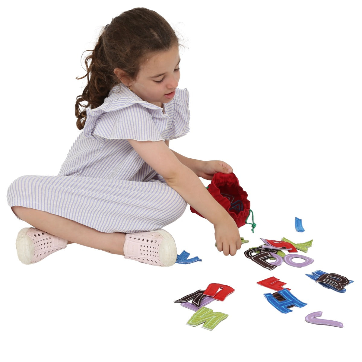 girl playing with the ABC Touch and Feel Letters