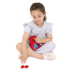 girl playing with the ABC Touch and Feel Letters