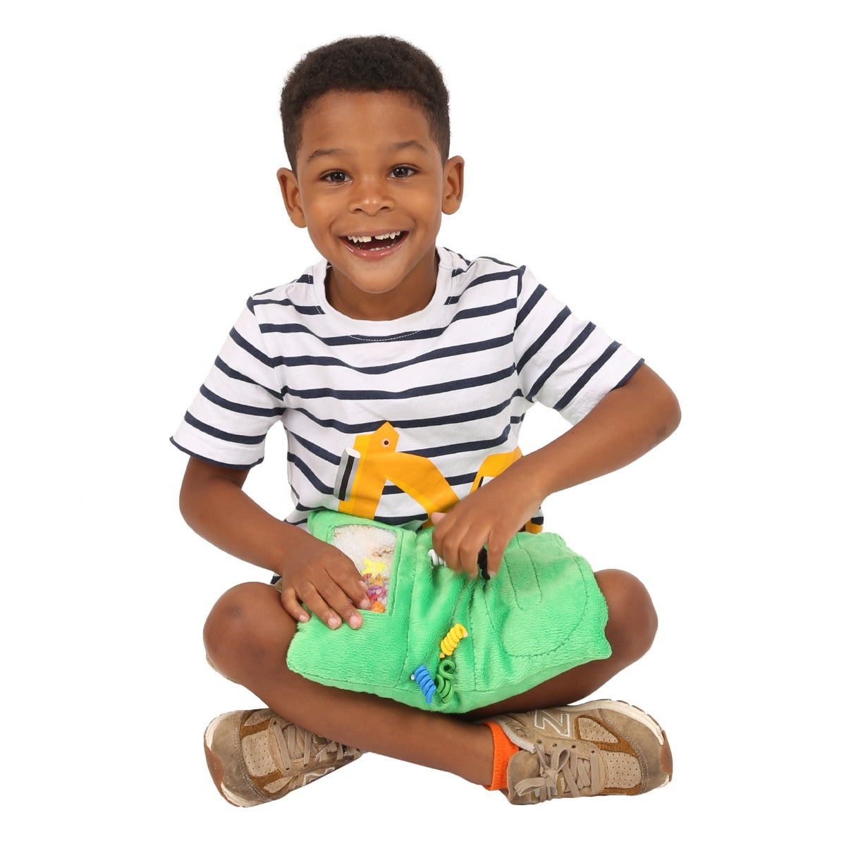Boy playing with the Busy Fingers™ Fidget Lap Pad